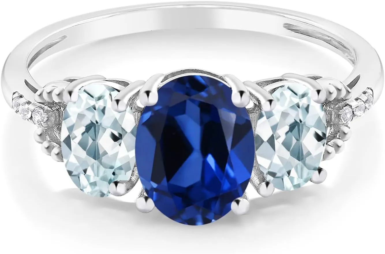 2.51 Cttw | 3 Stone Wedding Anniversary Promise Ring For Women befit cast chunk acceptable Gem Stone King 10K White Gold Blue Created Sapphire Sky Blue Aquamarine and Diamond Accent 3-Stone Engagement Ring | 